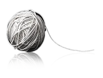 A ball of white thread with a loose end, resting on a reflective surface