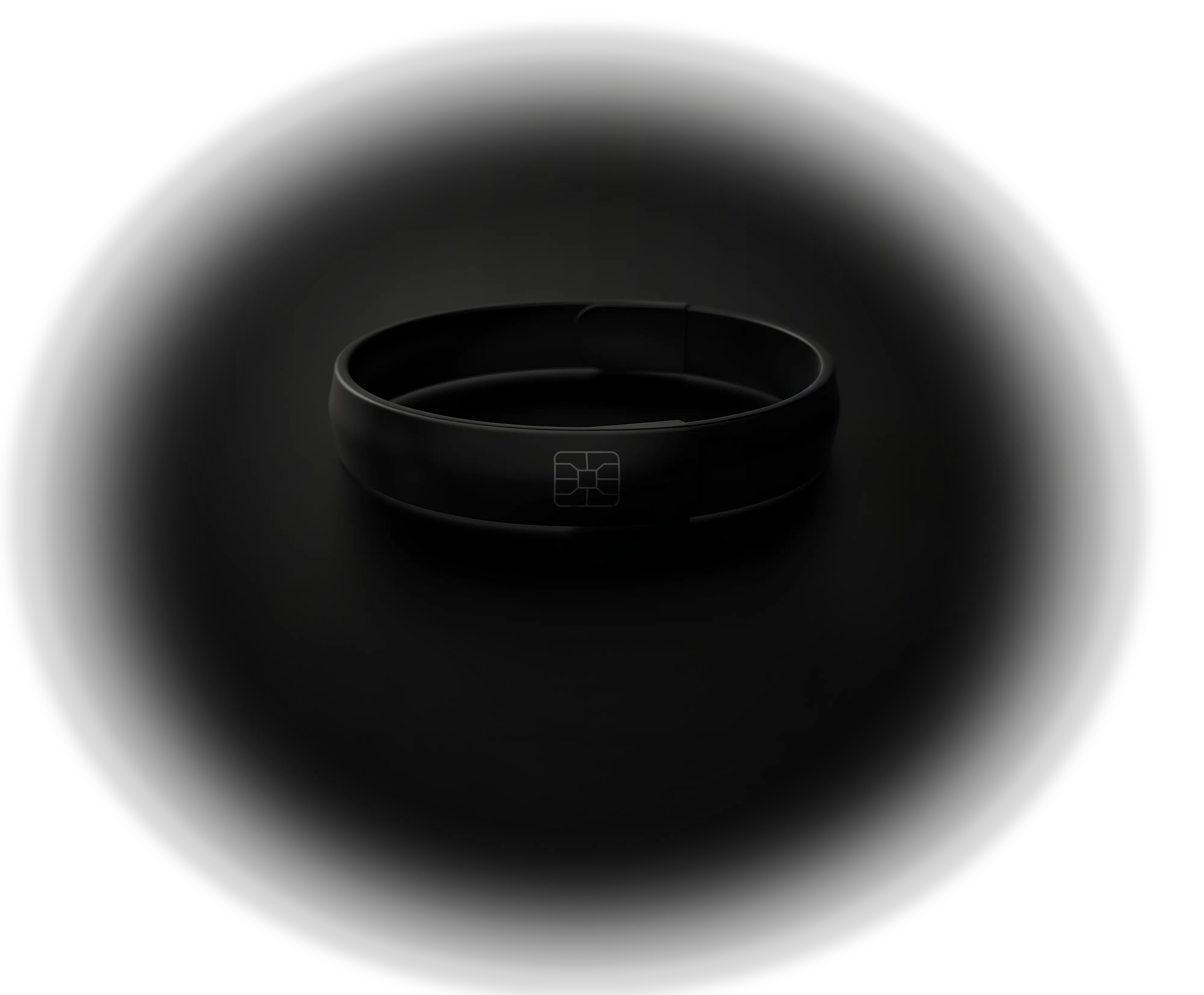 A black wristband with a subtle chip card design in the center, displayed on a dark background with soft lighting