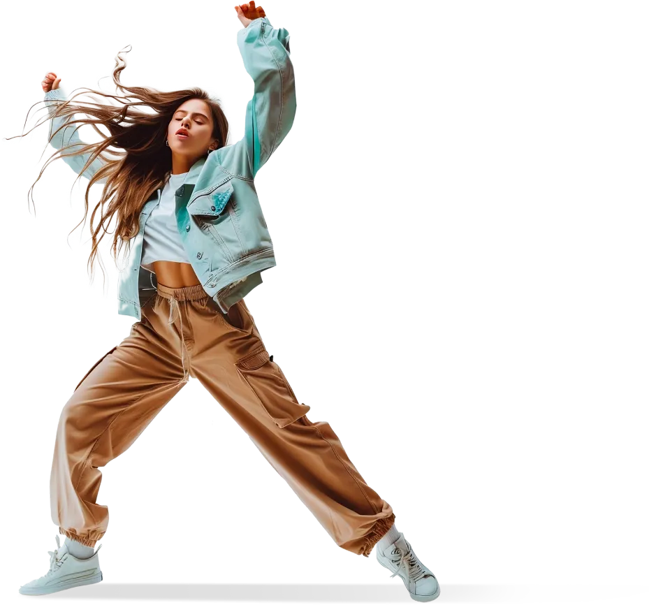A young woman in a light denim jacket and loose pants performing a dynamic jump in the air