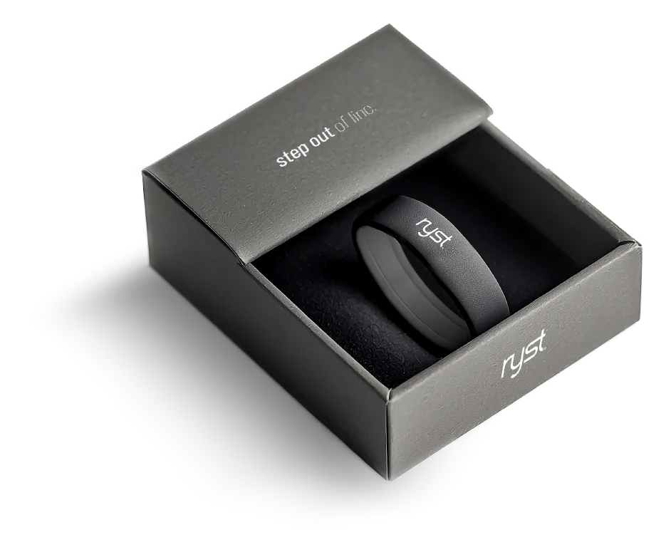 A black silicone band with the 'ryst' logo, packaged in an elegant black box with the text 'step out of line' on the lid.
