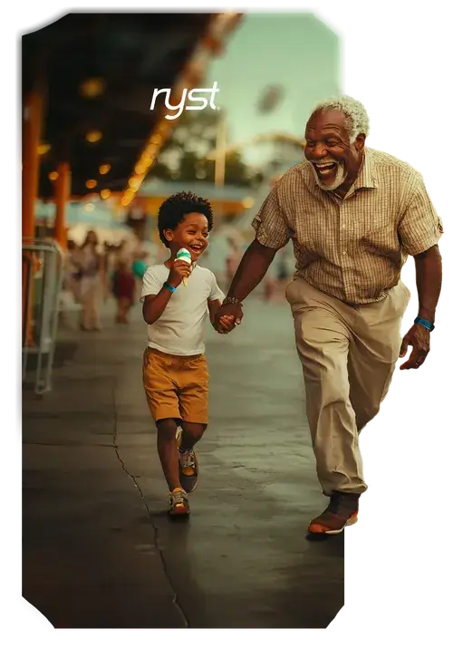An elderly man and a boy with an ice cream in hand joyfully running together along a promenade, surrounded by a festive atmosphere. The 'ryst' logo is visible above them